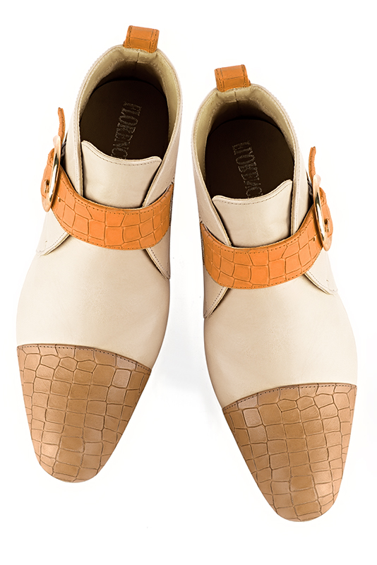 Camel beige, champagne white and marigold orange women's ankle boots with buckles at the front. Round toe. Low flare heels. Top view - Florence KOOIJMAN